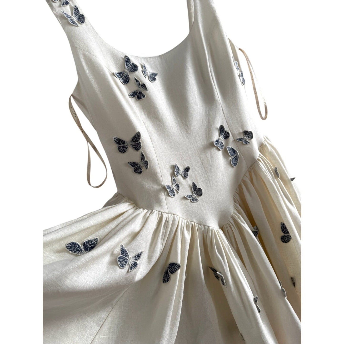 AGUA BY AGUA BENDITA Pluma Lymanopoda appliquéd gathered linen mini dress