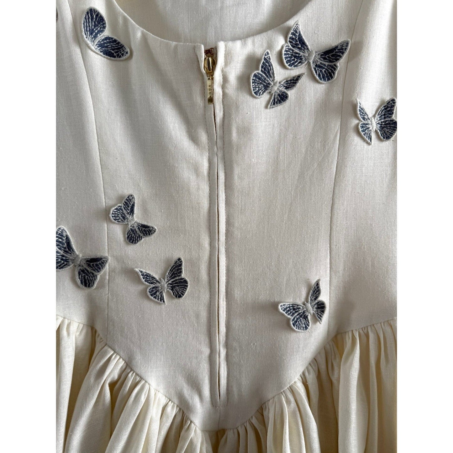 AGUA BY AGUA BENDITA Pluma Lymanopoda appliquéd gathered linen mini dress